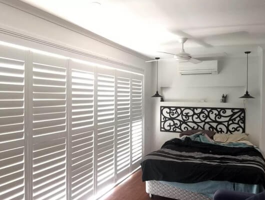 White plantation window shutters