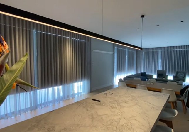 motorised roller blinds with wave fold sheer curtains