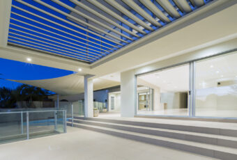 Modern white house exterior at night