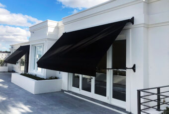 Retractable_awning_aalta_drop_arm_federation_style