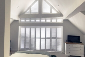 Shaped-plantation shutters