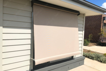 A beige coloured auto sunblind