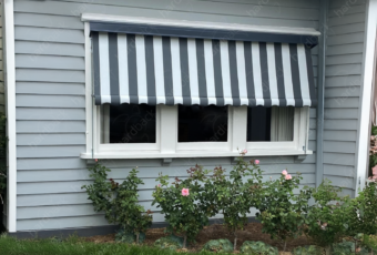 auto sunblind features a classic black and white striped canvas fabric